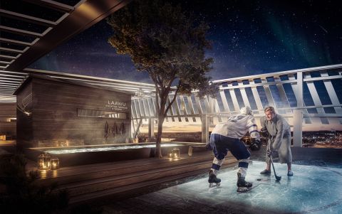 Lapland Hotels Arena mainoskuva. Kaksi miestä kattoterassilla pelaamassa jääkiekkoa. 
