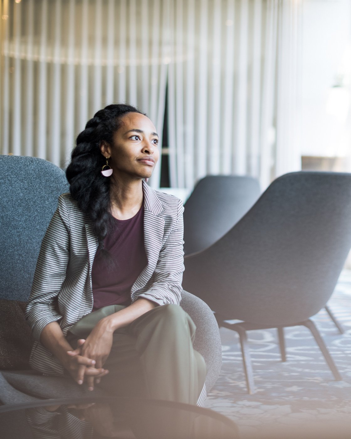 The person is sitting on a chair.