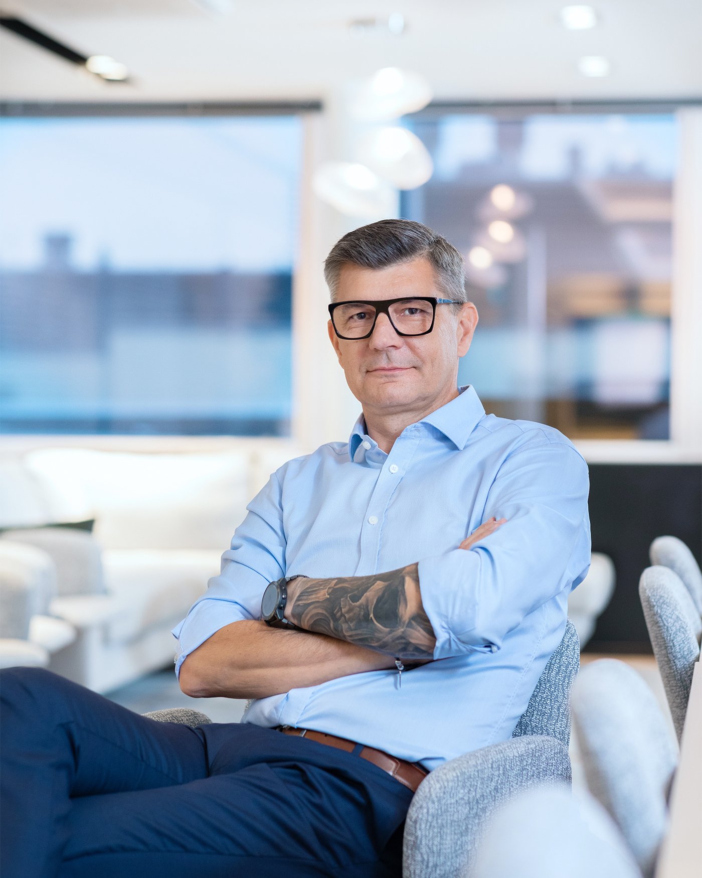 The person is sitting with their hands in the air.